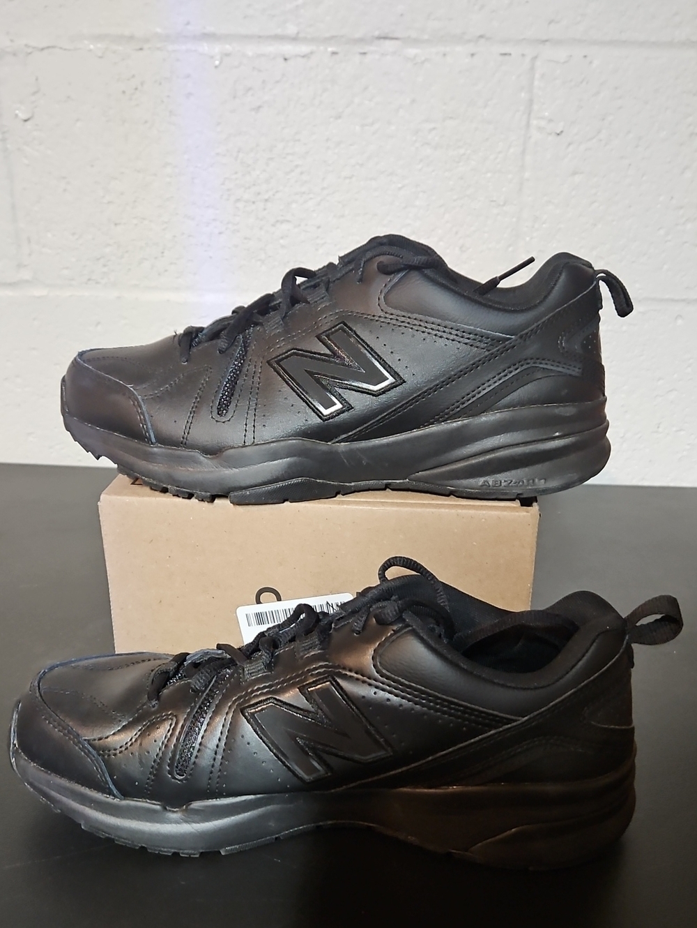 New Balance Men's All-Black Leather Athletic Sneakers